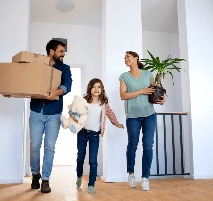 Happy family moving into a luxury apartment at Caldecotte Lake in Milton Keynes, representing modern lakeside living and family-friendly apartments.