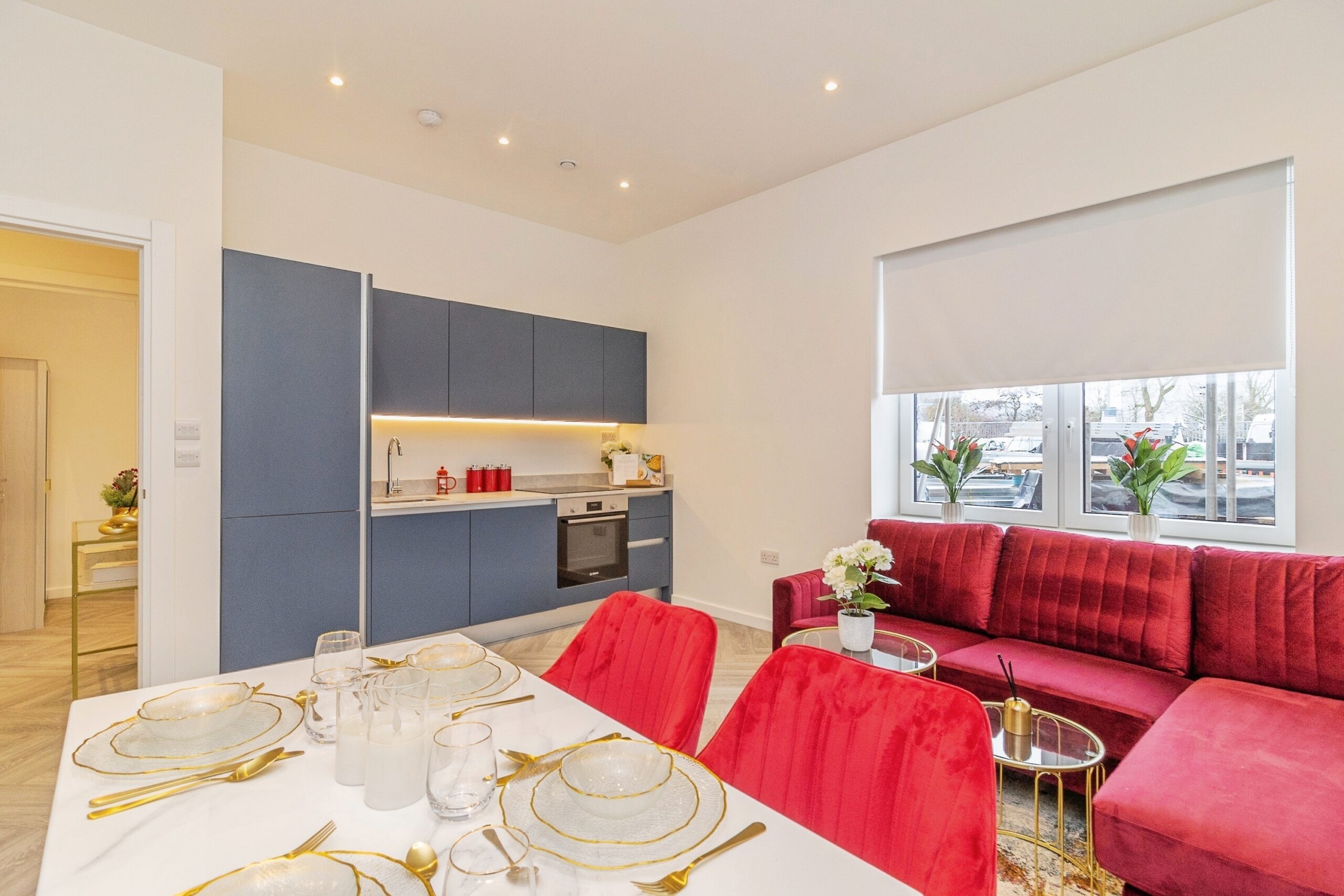 Luxury open-plan kitchen, dining, and living room at Caldecotte Lake apartments in Milton Keynes with modern design, premium finishes, natural light, and spacious lakeside interiors.