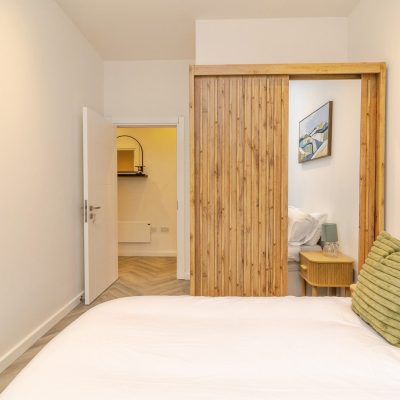 Luxury bedroom at Caldecotte Lake apartments in Milton Keynes with spacious layout, contemporary design, natural light, and high-quality finishes.